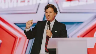 Conservative political commentator and podcast host Tucker Carlson speaks at Turning Point's annual AmericaFest conference, in remembrance of late right-wing political activist Charlie Kirk, in Phoenix, Arizona on December 18, 2025.