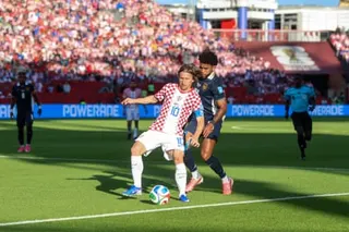 Croatia captain Luka Modric is challenged by Carlos Harvey of Panama.