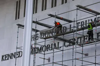 Workers construct scaffolding in preparation for the removal of US President Donald Trump’s name from facade of the Kennedy Centre in Washington on June 12. Photo: dpa