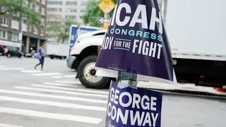 Campaign signage for State Rep. Micah Lasher and George Conway during a primary election in New York