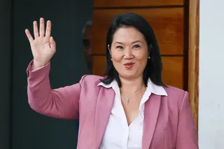 Keiko Fujimori waves as she leaves her home in San Borja district, Lima, on Wednesfay. Photo: AFP
