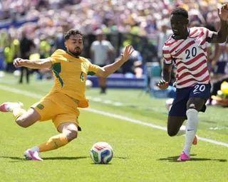 Jacob Italiano and Folarin Balogun compete for the ball