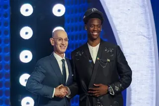 NBA commissioner Adam Silver (left) and AJ Dybantsa pose for a picture after he was drafted by the Washington Wizards on Tuesday night.