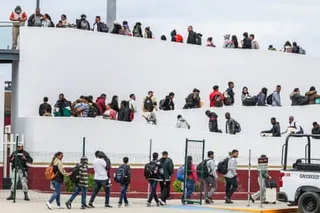 people walk up a ramp