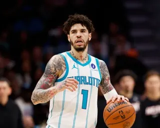 LaMelo Ball dribbles the basketball during a Charlotte Hornets game.