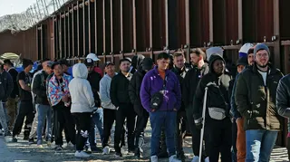 A long line of migrants at the US-Mexico border in 2023