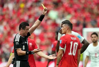 epa13061723 Granit Xhaka of Switzerland gets the yellow card from referee Ramon Abatti of Brazil during the FIFA World Cup 2026 group stage match Switzerland against Canada, in Vancouver, Canada, 24 June 2026.  EPA/BOB FRID