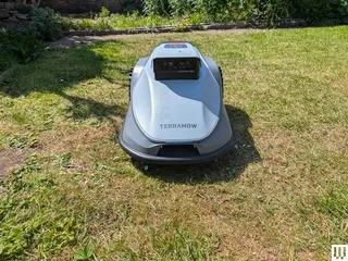 Image may contain: Grass, Lawn, Plant, Device, Lawn Mower, and Tool