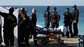 Police and emergency personnel at the scene after reports of a shark attack at Coogee Beach in Sydney, Australia, June 13, 2026.