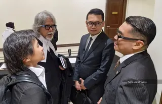 Conducting officer Deputy Public Prosecutor Mohd Fairuz Johari (right) and lawyer Azhier Farhan Arisin (left) during the inquest into the late Zara Qairina Mahathir at Kota Kinabalu Court Complex. NSTP/OLIVIA MIWIL