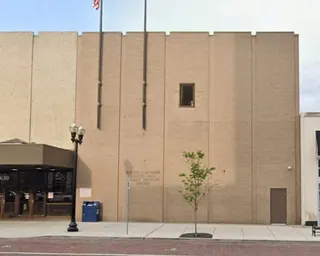 outside of a tan building