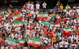Soccer Football - FIFA World Cup 2026 - Group G - Belgium v Iran - Los Angeles Stadium, Inglewood, California, U.S. - June 21, 2026 Iran fans display pre-Iranian Revolution "Lion and Sun" flags inside the stadium before the match