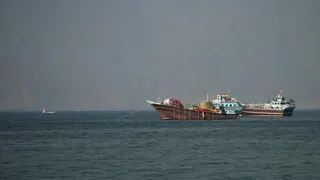 Smaller vessels anchored in the Strait of Hormuz.