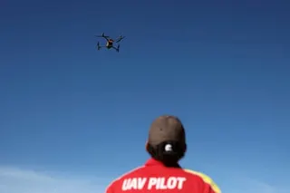 A unmanned aerial vehicle pilot flies a Surf Life Saving shark-spotting drone at Coogee beach in Sydney on 16 June.
