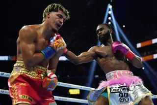 Jaron 'Boots' Ennis (right) throws a punch at Xander Zayas during their WBO and WBA super-welterweight title fight on Saturday in Brooklyn.