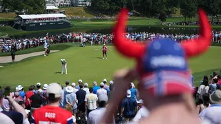 Viktor Hovland putts on the first green during the final round of the 2026 Travelers Championship, watched by some Norwegian fans