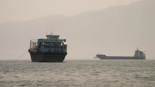 Vessels in the Strait of Hormuz as seen from Oman on 22 June, 2026.