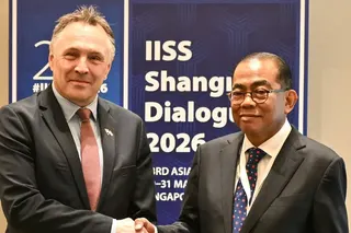 Malaysia’s Defence Minister Mohamed Khaled Nordin (right) shakes hands with his Norwegian counterpart Tore Sandvik on the sidelines of last month’s Shangri-La Dialogue security summit in Singapore. Photo: AFP