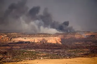 Smoke rises from mountains