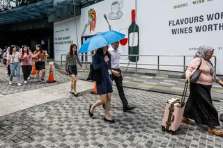 People walk on a street during lunch hour in Kuala Lumpur on July 2, 2025. — Picture by Firdaus Latif