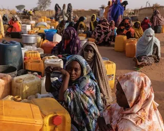 Refugees queuing for water