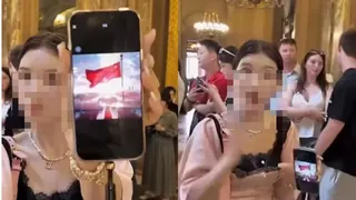 巴黎霸位拍照起争执 中国聋哑女网红亮国旗挨轰
