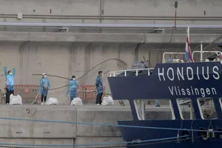 People in protective gear wait in line after disembarking from the hantavirus-stricken cruise ship MV Hondius docked at Tenerife in Spain’s Canary Islands in May. Photo: AFP