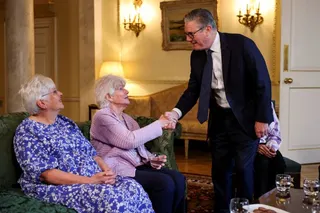 Britain's Prime Minister Keir Starmer shakes hands with Former Labour Member of Parliament, Ann Keen, who was forced to give up her baby boy for adoption at the age of 17, as he welcomes her and other campaigners for a meeting to discuss historical forced adoption, at Downing Street, in London, Britain, July 2, 2026. REUTERS/Isabel Infantes/Pool
