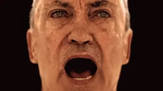 Trailer still from OD's reveal showing an older gentleman with his mouth open as he speaks
