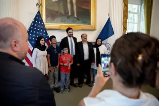 New York City Mayor Zohran Mamdani poses with a group of recently naturalized US citizens after he delivered a speech to mark the 250th anniversary of the United States of America at City Hall on July 3, 2026 in New York. (Photo by Anna CONNORS / POOL / AFP)