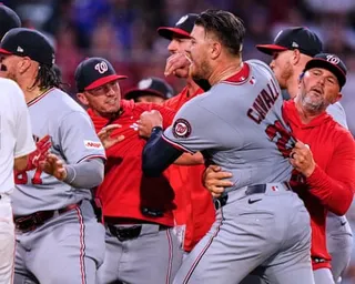 Cade Cavalli is held back by Nationals teammates during a fracas in Tuesday’s game against the Red Sox.