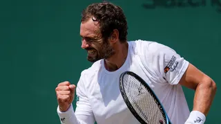 Roman Safiullin celebrates after defeating Joao Fonseca