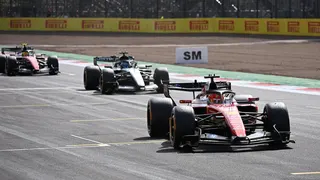 Ferrari's Charles Leclerc crosses the line to win the British Grand Prix with Mercedes George Russell and Ferrari's Lewis Hamilton behind him