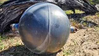 One of the six mysterious large silver spheres washed up on Forrest Beach in Queensland