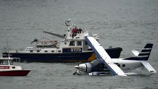 Emergency services on a boat respond to a crashed seaplane in the East River on 5 July 2026 in New York City.