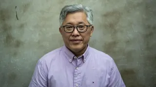 Jin Mingri, head pastor of the Zion church, in a lilac shirt pose for a photo in September 2018, days after authorities officially banned his church