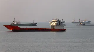Vessels in the Strait of Hormuz near the beach of Bandar Abbas, Iran, June 21, 2026.