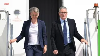 British Prime Minister Sir Keir Starmer (R) and British Foreign Secretary Yvette Cooper (L) disembark from a plane at Esenboga Airport ahead of the 2026 Nato summit in Ankara, 7 July