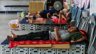 People sleeping on makeshift beds in Taiwan