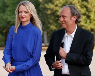 The French telecoms mogul Xavier Niel and his partner, Delphine Arnault, arrive at a state dinner upon the visit of the United Arab Emirates president at the Grand Trianon estate near the Palace of Versailles, in 2022.