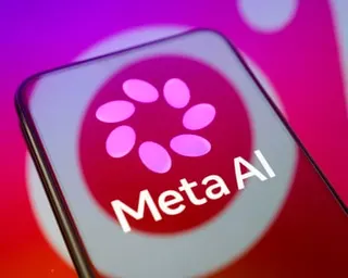 The Meta AI logo is displayed on a smartphone screen placed on a reflective surface