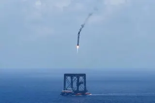 A drone photo shows the capturing of the returned first stage of the Long March-10B carrier rocket on a seaborne platform via a net-capture system, near Wenchang in southern China’s Hainan province on July 10. Photo: Xinhua via AP