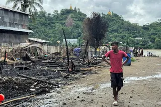 A man walks past the ruins of a building after an air strike by Myanmar’s military in Kyauktaw, western Rakhine State, Myanmar, on June 18, as part of Myanmar’s ongoing civil war. Photo: AFP