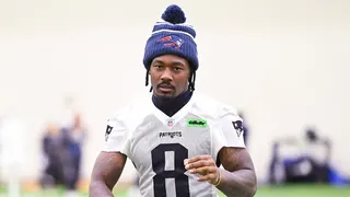 Stefon Diggs walks toward the podium