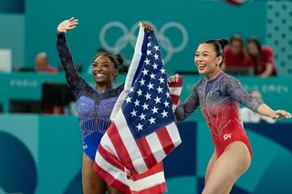 Sunisa Lee (right) and Simone Biles of the United States celebrate their medals during the women's all-around final at the Paris Olympic Games in 2024.