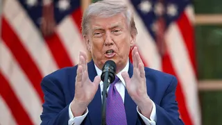 US President Donald Trump wearing a purple tie.