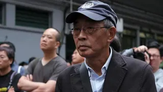 Bookseller Lam Wing-kee marches during a protest in Hong Kong to demand authorities scrap a proposed extradition bill with China. Photo: March 2019.