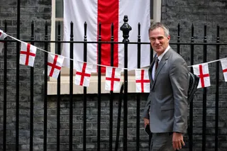 Britain's Business and Trade Secretary Peter Kyle walks past bunting with St George's Cross flags, displayed at Downing Street in a show of support for the England Men's soccer team competing in the FIFA World Cup 2026, on the day of a cabinet meeting, in London, Britain, July 15, 2026. REUTERS/Isabel Infantes   REFILE - ADDING MORE CONTEXT