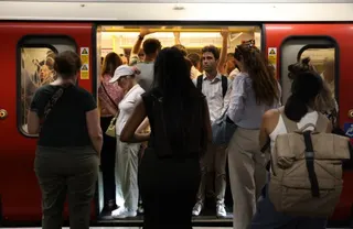 Commuters travel on a London Underground tube carriage, during a heatwave, in central London on June 24, 2026.
