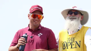 Lucas Herbert and caddie Nick Pugh laugh on the tee at Birkdale